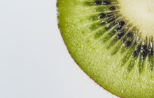 Close-up Of Kiwi Slice On White Background