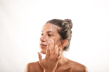 Wall Mural - Model putting face cream on