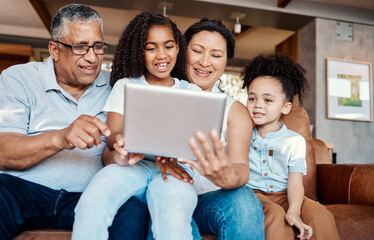 Canvas Print - Family, relax and girl with tablet on sofa in home living room for social media or funny video streaming. Technology, care and happy grandfather, grandma and kids laughing or bonding with touchscreen