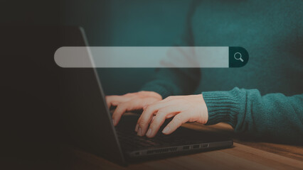 Poster - Man hand working with laptop computer on table in his home. Search the Internet with an empty search bar. Best SEO search networking, Searching browsing internet data information concept.