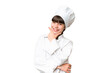 Little caucasian chef girl over isolated background smiling