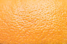 Defocused And Blurred Grapefruit Orange Skin Macroclose Up With Pores