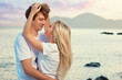 © Loginova - Love and romance. Honeymoon on the sea shore. Beautiful loving couple embracing on the beach