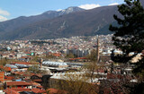 Fototapeta Miasta - A panoramic view of the city of Bursa (Turkey) with many mosques, hans and Uludag mountain in the background