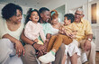 © Charlize D/peopleimages.com - Black family laughing, portrait and living room sofa of a mother, father and children with grandparent. Happy, smile and bonding of a mom, dad and young kids together having fun with love and support