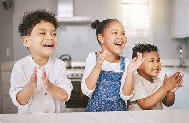 Poster - Were all winners at grandma and grandpas house. Shot of three cheerful siblings celebrating while baking in a kitchen.