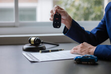 Car Auction Concept Lawyer Working At A Table In A Court Of Law The Concept Of Selling A Car By Auction Or Fair Law.