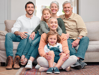 Wall Mural - You glow differently with family. Portrait of a happy family bonding on the sofa at home.