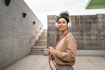 Wall Mural - one woman young adult caucasian female with jumping rope training