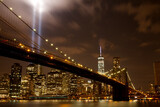 Fototapeta  - Brooklyn bridge with Tribute in Light . The installation of 88 searchlights has been displayed annually in remembrance of the September 11, 2001 attacks.