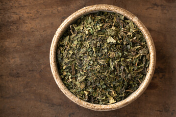 Wall Mural - Dried Nettle Leaf in a Bowl