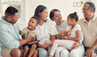 © David L/peopleimages.com - Love, black family and happy together, with smile and bonding for quality time, loving and on sofa. Grandparents, mother and father with children, for happiness and positive to connect and in lounge.