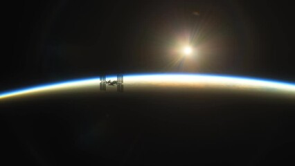 Wall Mural - international space station iss floating in orbit above planet earth in outer space. sunrise or suns