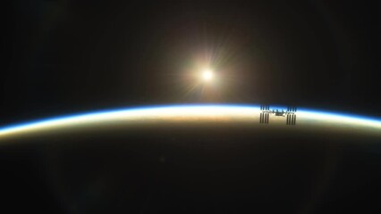 Wall Mural - international space station iss floating in orbit above planet earth in outer space. sunrise or suns