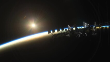 Wall Mural - international space station iss floating in orbit above planet earth in outer space. sunrise or suns