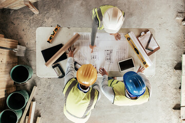 Poster - Top view, construction workers or blueprint planning in house, home or office building in real estate, property or architecture innovation. Men, engineering woman or construction site people or ideas