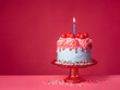 Birthday Drip Cake with lit candle on a red stand with colorful sprinkles on a vibrant pink background