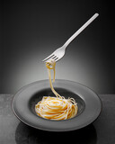 Fototapeta Miasto - Flying fork with spagetti