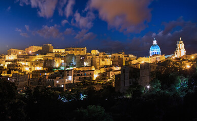 Wall Mural - Night old medieval Ragusa famos Sicilian town view (Sicily, Italy). City lights of famous touristic destination. Unesco world heritage site.