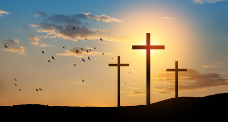 christian crosses on hill outdoors at sunrise. resurrection of jesus.