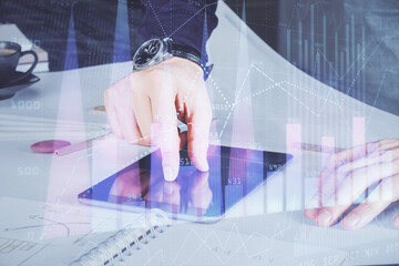 Poster - Double exposure of man's hands holding and using a digital device and forex graph drawing. Financial market concept.