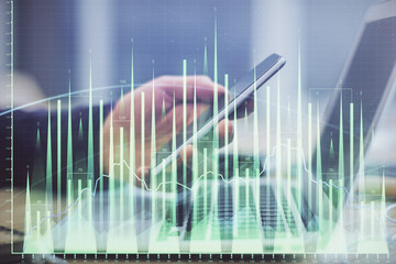 Aufkleber - Double exposure of man's hands holding and using a phone and financial graph drawing. Analysis concept.