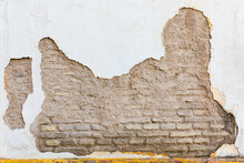 Old Bricked House Wall With Cracked Paint