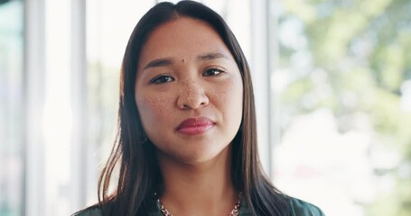 Canvas Print - Face, vision and mindset with a business asian woman in her office, standing by a window with flare. Portrait, confidence and mission with a female employee at work with her focus on the future