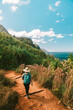 © Ryan Longnecker - Female Hiker on Tropical Coastline