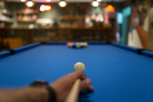 Cropped Image Of Hand Playing Pool
