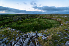 The Unique Cahercommaun Triple Ring Fort Is Situated On The Edge Of An Inland Cliff Facing, The Burren National Park, County Clare, Ireland