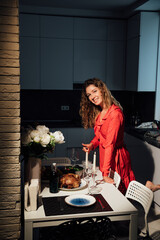 a woman in a red dress cooks dinner with chicken duck meat