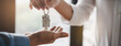 © Pormezz - Realtor agent giving a key of apartment to new owner after signed lease agreement.