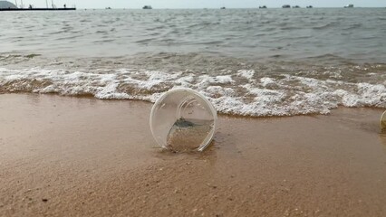 Poster - A plastic cup waste material pollution on beach