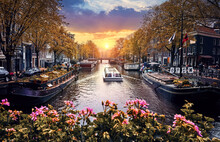 Channel In Amsterdam Netherlands Holland Houses Under River Amstel. Pleasure Boats With Tourists On The Water. Flowers Bringe. Beautiful Sunset And House (houseboats) Along