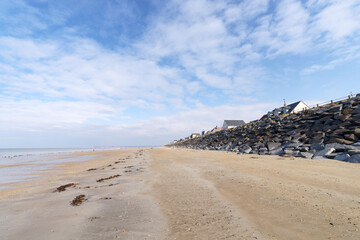 Wall Mural - Beach and riprap of Hauteville-sur-Mer village in the Cotentin coast