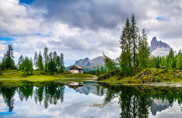 Wall Mural - Amazing Lago Di Federa See with beautiful reflection. Majestic Landscape with Dolomites peak, Cortina D'Ampezzo, South Tyrol, Dolomites, Italy. Travel in nature. Artistic picture. Beauty world.