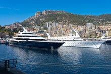 Two megayachts are in Monaco's Hercules harbor.