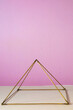 Giza energy pyramid, used by some Cuban people to cure and heal. Three dimensional geometrical structure. Pink background