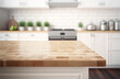 © Limitless Visions - Selective focus.Wood table top counter island  and blur kitchen room background.