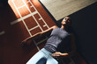 © Flamingo Images - Tired woman lying on a gym floor