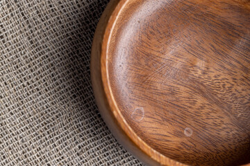 Wall Mural - an old empty wooden bowl on the table