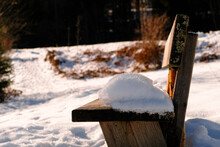 Old Wooden Bench Covered With Snow