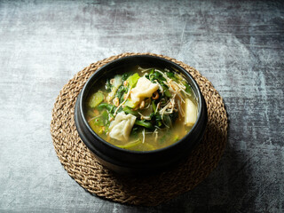 Wall Mural - Soybean paste stew made with various vegetables and flour dough	