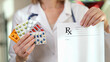 © megaflopp - Pharmacist is holding prescription paper and lot of medical pills in her hands close-up.