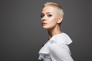 Wall Mural - portrait of short hair beautiful young woman. sensual girl with make-up and blond hair