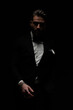 © Viorel Sima - bearded young man in black tuxedo posing in a mysterious way