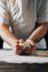 Man kneading pizza dough