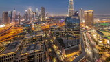 Fototapeta Nowy Jork - Futuristic Dubai Downtown and finansial district skyline aerial day to night timelapse.