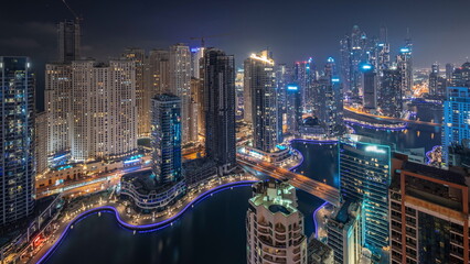 Wall Mural - View of various skyscrapers in tallest recidential block in Dubai Marina aerial night timelapse